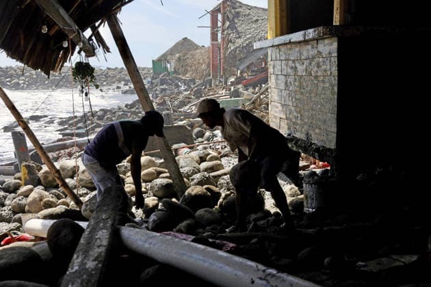 Tropical Storm Cristina hit Puerto Madero of Mexico TAPACHULA, MEXICO - JUNE 09: Two men are working on debris removal in a restaurant, following the damage from tropical storm Cristina in the coastal community of Puerto Madero, near Tapachula, Mexico, on Tuesday, June 09, 2026. The storm caused severe damage along the Mexican Pacific coast in the state of Chiapas, near the Guatemala border, where strong waves and storm surges impacted dozens of homes and restaurants, affecting hundreds of residents. Jose Torres Anadolu Tapachula Mexico. Editorial use only. Please get in touch for any other usage.  Copyright: x2026xAnadoluxJosexTorresx