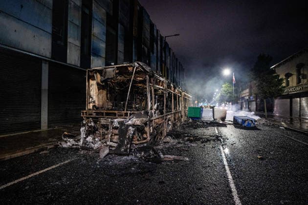 June 9, 2026, Belfast, Antrim, United Kingdom: A burnt out bus seen after an anti-immigration protest. Belfast erupted into flames as locals took to the streets to protest against the stabbing of a North Belfast man by a Sudanese national refugee. Road blockades were set up all over Belfast bringing much of the city to a standstill. The protestors are demanding a stop to immigration into Northern Ireland. Belfast United Kingdom - ZUMAs197 20260609_aaa_s197_275 Copyright: xLabxMox
