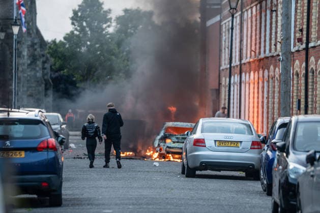 June 9, 2026, Belfast, Antrim, United Kingdom: One of many cars firebombed during an anti-immigration protest. Belfast erupted into flames as locals took to the streets to protest against the stabbing of a North Belfast man by a Sudanese national refugee. Road blockades were set up all over Belfast bringing much of the city to a standstill. The protestors are demanding a stop to immigration into Northern Ireland. Belfast United Kingdom - ZUMAs197 20260609_aaa_s197_288 Copyright: xLabxMox