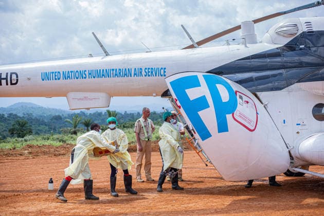 (260610) -- KINSHASA, June 10, 2026 () -- Medical workers in protective suits carry medical supplies against the Ebola epidemic in Mongbwalu, Ituri province, the Democratic Republic of the Congo, June 9, 2026. The number of confirmed Ebola cases in the Democratic Republic of the Congo (DRC) has risen to 598, including 115 deaths, the country s public health authorities said Tuesday. () (SpotNews) DR CONGO-ITURI-EBOLA OUTBREAK-HEALTH MEASURES Xinhua 