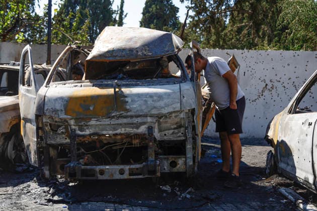 June 10, 2026, Saida, Saidon District, lebanon: An Israeli drone strike targeted a van in the Al-Bawaba Al-Fawqa area adjacent to the commercial market in central Sidon (Saida), southern Lebanon, killing two people and igniting a fire that spread to several nearby vehicles. The attack occurred near the Maronite Church and a fuel station in a densely populated civilian area. Emergency responders and civil defense teams recovered the victims and worked to extinguish the blaze, which damaged at least four neighboring cars. Saida lebanon - ZUMAb339 20260610_znp_b339_003 Copyright: xAbdulxKaderxAlxBayx