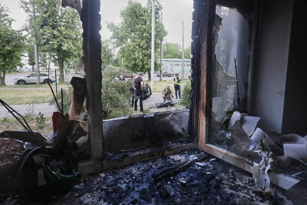 Law enforcement officers examine the wreckage of a strike drone used by Russian forces to attack a district of Kharkiv, Ukraine, June 10, 2026. Russian forces struck the northeastern city with drones, injuring at least eight people. One of the drones hit an apartment block, housing a dental office. (Photo by Viacheslav Madiievskyi Ukrinform) Russians damage dental office in Kharkiv  Copyright: xViacheslavxMadiievskyix