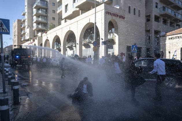 Police intervene as Ultra-Orthodox Jews block roads in West Jerusalem WEST JERUSALEM - JUNE 10: Israeli police use stun grenades and water cannons to disperse Ultra-Orthodox (Haredi) Jews blocking roads during a protest on June 10, 2026. Three demonstrators were detained during the incidents in West Jerusalem, where crowds gathered to protest against compulsory military service. Mostafa Alkharouf Anadolu Jerusalem Israel. Editorial use only. Please get in touch for any other usage.  Copyright: x2026xAnadoluxMostafaxAlkharoufx