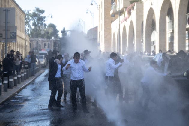 Police intervene as Ultra-Orthodox Jews block roads in West Jerusalem WEST JERUSALEM - JUNE 10: Israeli police use stun grenades and water cannons to disperse Ultra-Orthodox (Haredi) Jews blocking roads during a protest on June 10, 2026. Three demonstrators were detained during the incidents in West Jerusalem, where crowds gathered to protest against compulsory military service. Mostafa Alkharouf Anadolu Jerusalem Israel. Editorial use only. Please get in touch for any other usage.  Copyright: x2026xAnadoluxMostafaxAlkharoufx