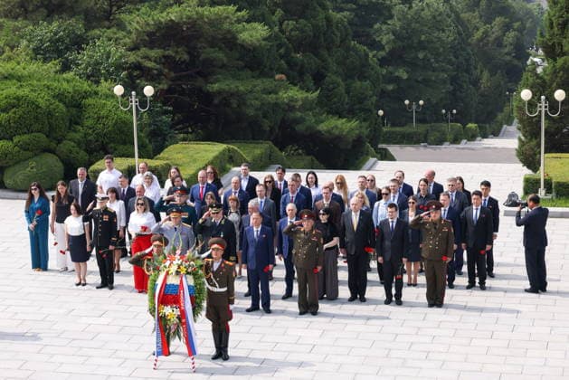 NORTH KOREA, PYONGYANG - JUNE 11, 2026: Staff members of Russian institutions attend a wreath laying ceremony at the Liberation Monument marking the upcoming Russia Day. Stanislav Varivoda TASS  93653374