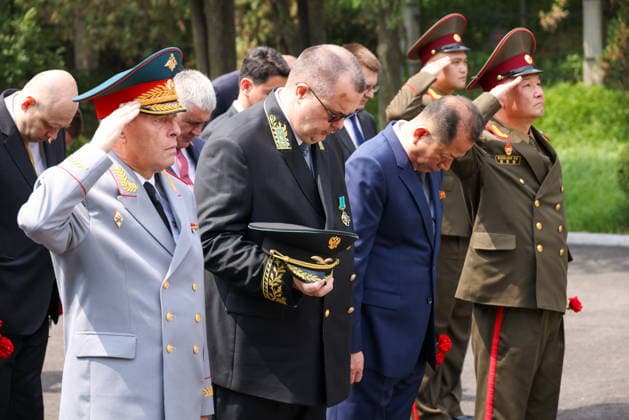 NORTH KOREA, PYONGYANG - JUNE 11, 2026: Russian Defence Attache Alexei Bartusov (L) and Vladimir Topekha, Russian Charge d Affaires ad interim in North Korea, attend a wreath laying ceremony at the Liberation Monument marking the upcoming Russia Day. Stanislav Varivoda TASS  93653481