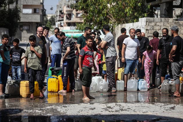 Displaced Palestinians queue for water in central Gaza Displaced Palestinians gather to collect drinking water and water for daily use from a mobile distribution truck in the Bureij refugee camp in the central Gaza Strip on June 11, 2026. Palestinians in Gaza face a severe shortage of drinking and household water as wells and water facilities remain disrupted due to shortages of fuel and spare parts, forcing residents to wait for hours and travel long distances to obtain limited supplies amid rising temperatures and increased demand during the summer season. Photo by Moiz Salhi apaimages Nusairat Gaza Strip Palestinian Territory 110626_Bureij_MS_00(15) Copyright: xapaimagesxMoizxSalhixx xapaimagesx