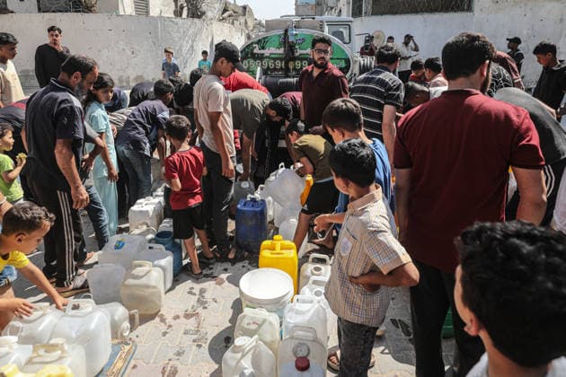 Displaced Palestinians queue for water in central Gaza Displaced Palestinians gather to collect drinking water and water for daily use from a mobile distribution truck in the Bureij refugee camp in the central Gaza Strip on June 11, 2026. Palestinians in Gaza face a severe shortage of drinking and household water as wells and water facilities remain disrupted due to shortages of fuel and spare parts, forcing residents to wait for hours and travel long distances to obtain limited supplies amid rising temperatures and increased demand during the summer season. Photo by Moiz Salhi apaimages Nusairat Gaza Strip Palestinian Territory 110626_Bureij_MS_00(5) Copyright: xapaimagesxMoizxSalhixx xapaimagesx