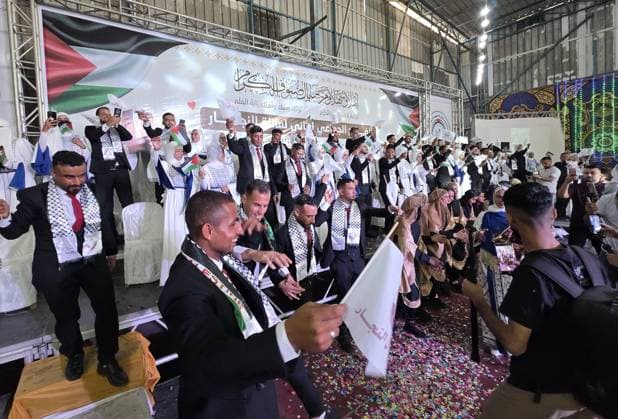 Mass wedding brings hope to displaced couples in Gaza Palestinian brides and grooms take part in the collective wedding ceremony Window of Hope in Khan Younis, southern Gaza Strip, on June 11, 2026. The event brought together dozens of displaced couples from the town of Khuza a, east of Khan Younis, as part of an initiative aimed at supporting newlyweds, easing social and economic burdens, and highlighting the community’s efforts to preserve moments of joy despite ongoing hardship. Photo by Tariq Mohammad APA Images Khan Yunis Gaza Strip Palestinian Territory 110626_Khan_Yunis_TM_01(1) Copyright: xapaimagesxTariqxMohammad xapaimagesx