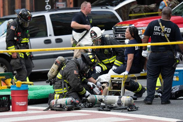 June 11, 2026, Washington, Dc, United States: Washington, D.C. fire fighters are decontaminated following a suspcious package incident near the Foggy Bottom Metro station in Washington, D.C. on June 11, 2026. Washington United States - ZUMAl312 20260611_znp_l312_048 Copyright: xAndrewxLeydenx