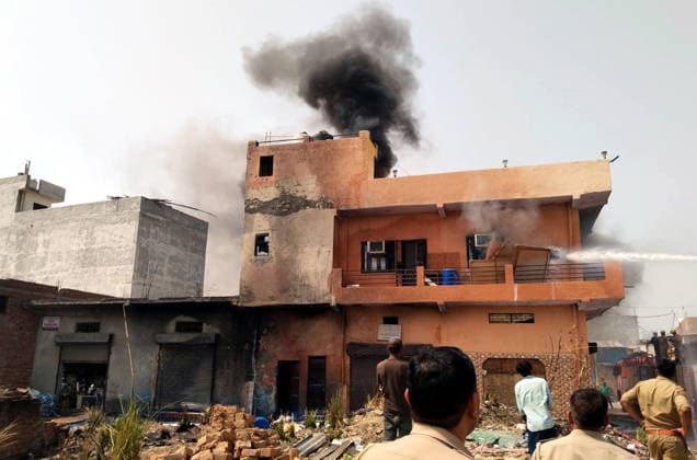 GHAZIABAD, INDIA - JUNE 11: Onlookers watch as firefighters battle fire that erupted at a chemical factory in Hindon Vihar near Nandgram on June 11, 2026 in Ghaziabad, India. (Photo by Sakib Ali Hindustan Times) Massive Fire Broke Out At A Chemical Factory In Ghaziabad