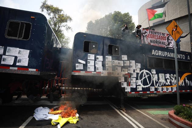 Demonstrators clash with police during the World Cup opener in Mexico City MEXICO CITY, MEXICO - JUNE 11: Smoke and flames rise from the burning materials during a protest against the World Cup, in Mexico City, Mexico on June 11, 2026. Thousands of demonstrators marched toward Banorte Stadium to protest against the World Cup, while some clashed with riot police outside the stadium where the World Cup opener was taking place. Daniel Cardenas Anadolu Mexico City Mexico. Editorial use only. Please get in touch for any other usage.  Copyright: x2026xAnadoluxDanielxCardenasx