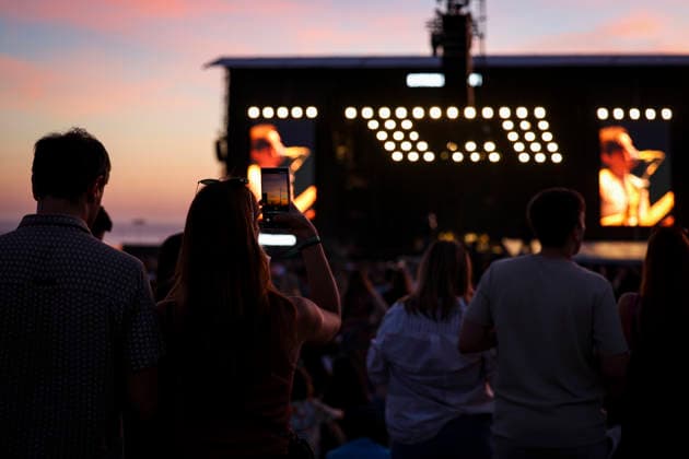 June 11, 2026, Porto, Portugal: Festival goer takes photos during the concert as the sun sets on the first day of the Primavera Sound festival. Porto Portugal  - ZUMAs197 20260611_aaa_s197_126 Copyright: xRitaxFrancax