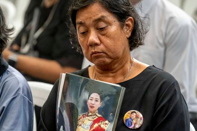 June 12, 2026, Bangkok, Bangkok, Thailand: A member of the Thai public sits and holds a portrait of HRH Princess Bajrakitiyabha inside Chulalongkorn hospital while mourning her passing which took place the previous evening. Princess Bajrakitiyabha had been hospitalized since December, 2022 after suffering a cardiac episode while training her pet dog. Bangkok Thailand - ZUMAt128 20260612_zap_t128_001 Copyright: xAdryelxTalamantesx