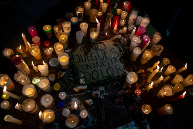 Mexico City Missing Persons March Candles burn around a sign reading No juegues con nuestro dolor during a demonstration for missing persons in Mexico City, Mexico, on June 10, 2026. The march, heading toward Estadio Azteca as part of the Let s illuminate the search event, brought together families from various Mexican states calling for justice for their missing relatives. Mexico City Mexico City Mexico Copyright: xXavierxDuartex