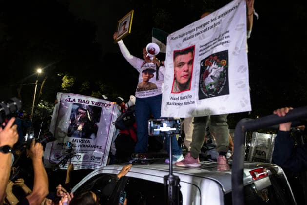 Mexico City Missing Persons March Demonstrators stand on a police vehicle while holding banners with portraits of missing persons in Mexico City, Mexico, on June 10, 2026. The march, heading toward Estadio Azteca as part of the Let s illuminate the search event, brought together families from various Mexican states calling for justice for their missing relatives. Mexico City Mexico City Mexico Copyright: xXavierxDuartex