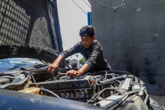 World Day Against Child Labour in Gaza GAZA CITY, GAZA, PALESTINE - JUNE 11: 12-year-old Palestinian Sami Ibrahim Hammad, who lost his father in Israeli attacks on Gaza, works long hours at an auto repair shop to support himself and his family instead of continuing his education during the World Day Against Child Labour on June 12, 2026 in Gaza City, Gaza, Palestine. Khalil Ramzi Alkahlut Anadolu Gaza City Gaza. Editorial use only. Please get in touch for any other usage.  Copyright: x2026xAnadoluxKhalilxRamzixAlkahlutx