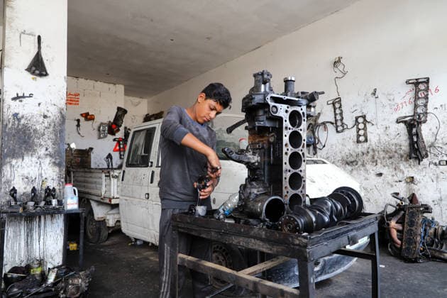 World Day Against Child Labour in Gaza GAZA CITY, GAZA, PALESTINE - JUNE 11: 12-year-old Palestinian Sami Ibrahim Hammad, who lost his father in Israeli attacks on Gaza, works long hours at an auto repair shop to support himself and his family instead of continuing his education during the World Day Against Child Labour on June 12, 2026 in Gaza City, Gaza, Palestine. Khalil Ramzi Alkahlut Anadolu Gaza City Gaza. Editorial use only. Please get in touch for any other usage.  Copyright: x2026xAnadoluxKhalilxRamzixAlkahlutx