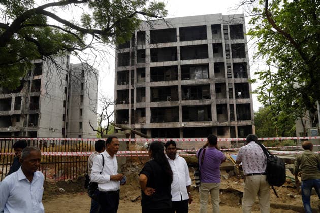 Prayer meeting held in memory of Air India Flight 171 plane crash victims in Ahmedabad AHMEDABAD, INDIA - JUNE 12: People stand near the damaged residential buildings at a site where Air India flight 171 crashed last year, in Ahmedabad, India on June 12, 2026. Stringer Anadolu Ahmedabad India. Editorial use only. Please get in touch for any other usage.  Copyright: x2026xAnadoluxStringerx