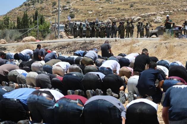 Palestinians Hold Friday Prayers on Land Threatened by Confiscation Near Hebron IDHNA, WEST OF HEBRON, WEST BANK JUNE 12, 2026: Palestinians perform Friday prayers on agricultural land threatened with confiscation in the village of Idhna, west of Hebron. The area has been the site of reported settler attacks and crop-burning incidents, with residents gathering to demonstrate their presence on the land and express opposition to its loss. photo by Mosab shawer JNA Press HEBRON Palestine, State of Copyright: x xMosabxshawerx xJNAxPressx