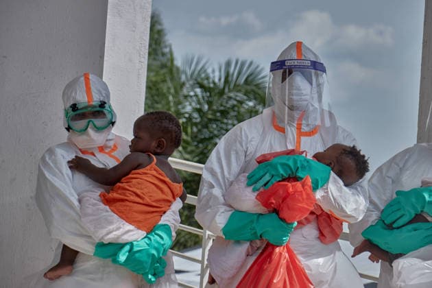 (260612) -- BUNIA, June 12, 2026 () -- Medical workers holding babies are pictured at an Ebola treatment center in Bunia, Ituri Province, the Democratic Republic of the Congo, June 9, 2026. The number of confirmed Ebola cases in the Democratic Republic of the Congo (DRC) has risen to 676, including 136 deaths, as health authorities warned of continued community transmission and the risk of a sudden geographic expansion of the outbreak. () DR CONGO-ITURI-EBOLA OUTBREAK-CONFIRMED CASES Xinhua 