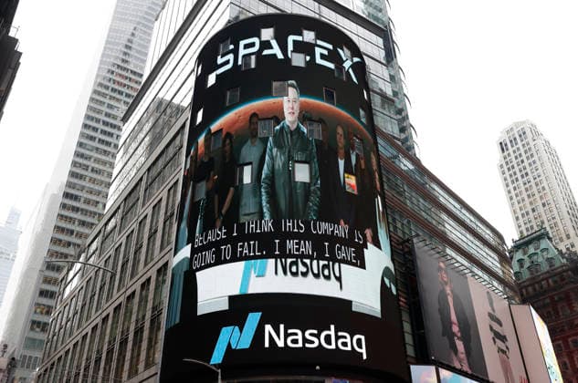 Spectators watch the screens in Times Square showing visuals of Elon Musk and SpaceX branding at the Nasdaq MarketSite Exchange in Times Square on Friday, June 12, 2026 in New York City. Elon Musk celebrated the Nasdaq opening bell Friday as SpaceX prepared to start trading publicly and possibly cementing his status as a trillionaire.  NYP20260612211 JOHNxANGELILLO
