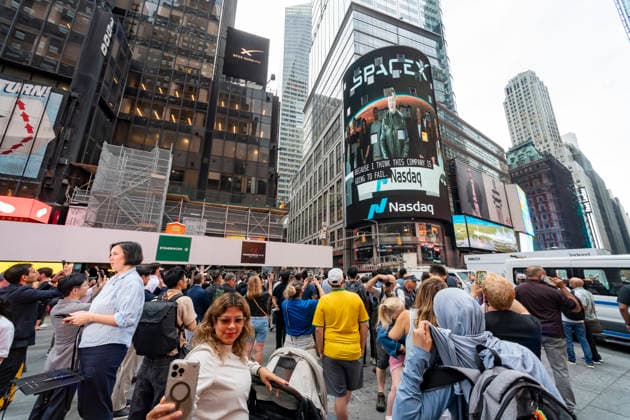 SpaceX largest IPO in history Elon Musk speaking from Texas shown on NASDAQ headquarters in Times Square in New York on Friday, June 12, 2026 at the debut of his SpaceX IPO. The IPO price was set at $135 a share making it the largest IPO in history and making Elon Musk the world™s first trillionaire. (  RichardxB.xLevine