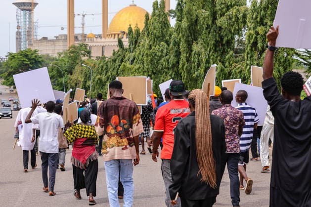 Protest held on Democracy Day over security and economic crisis in Nigeria ABUJA, NIGERIA - JUNE 12: People chanting slogans against the government and carrying banners attend a protest held on June 12 Democracy Day against rising security and economic problems in Abuja, Nigeria, on June 12, 2026. In the demonstration, which saw high participation, protesters expressed their reaction to increasing security issues in the country, mass kidnappings of students from schools, and economic hardship. Emmanuel Osodi Anadolu Abuja Nigeria. Editorial use only. Please get in touch for any other usage.  Copyright: x2026xAnadoluxEmmanuelxOsodix