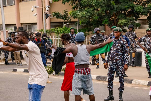 Protest held on Democracy Day over security and economic crisis in Nigeria ABUJA, NIGERIA - JUNE 12: Security measures are taken by closing a main road as people chanting slogans against the government and carrying banners attend a protest held on June 12 Democracy Day against rising security and economic problems in Abuja, Nigeria, on June 12, 2026. Emmanuel Osodi Anadolu Abuja Nigeria. Editorial use only. Please get in touch for any other usage.  Copyright: x2026xAnadoluxEmmanuelxOsodix