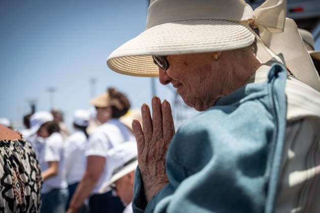 Pope Leo XIV visits Tenerife in Spain TENERIFE, CANARY ISLANDS, SPAIN - JUNE 12: People attend Mass as Pope Leo XIV celebrates a service before tens of thousands of worshippers at the Port of Santa Cruz de Tenerife in the Canary Islands, Spain on June 12, 2026. The open-air liturgy marked the culmination of his seven-day apostolic visit to Spain and followed a day focused on migration and human dignity in the Canary Islands, a key gateway on the Atlantic migration route. In his homily, the pontiff urged solidarity, reconciliation, and a renewed commitment to placing people before economic interests. Andres Gutierrez Anadolu Canary Islands Spain. Editorial use only. Please get in touch for any other usage.  Copyright: x2026xAnadoluxAndresxGutierrezx