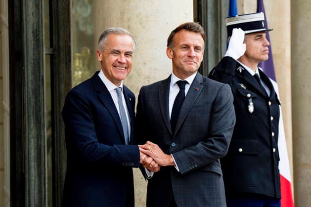 June 12, 2026, Paris, France: Prime Minister Mark Carney, left, is greeted by French President Emmanuel Macron at the Palais de löÄÃ Elysee in Paris, on Friday, June 12, 2026. Paris France  - ZUMAc35_ 20260612_zaf_c35_068 Copyright: xChristopherxKatsarovx