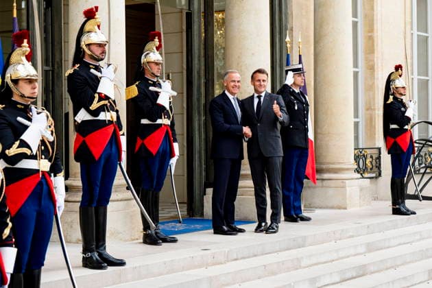 June 12, 2026, Paris, France: Prime Minister Mark Carney, left, is greeted by French President Emmanuel Macron at the Palais de löÄÃ Elysee in Paris, on Friday, June 12, 2026. Paris France  - ZUMAc35_ 20260612_zaf_c35_069 Copyright: xChristopherxKatsarovx