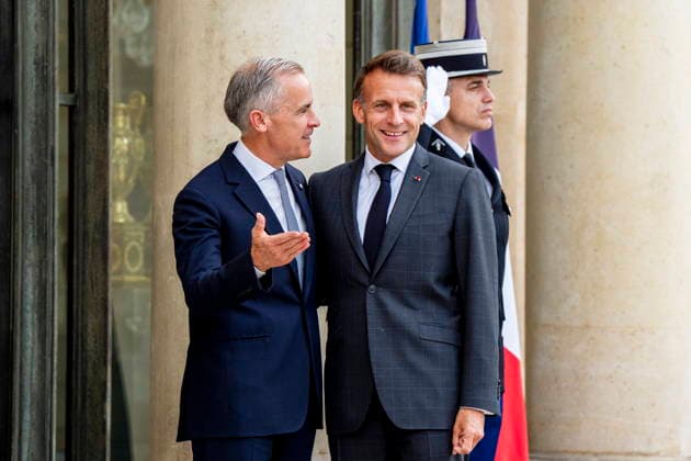 June 12, 2026, Paris, France: Canadian Prime Minister Mark Carney, left, is greeted by French President Emmanuel Macron at the Palais de löÄÃ Elysee in Paris, on Friday, June 12, 2026. Paris France  - ZUMAc35_ 20260612_zaf_c35_078 Copyright: xChristopherxKatsarovx
