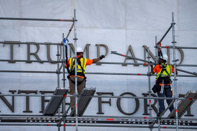 Construction workers build a scaffolding near the sign for the Donald J. Trump and The John F. Kennedy Memorial Center for the Performing Arts in Washington, DC on Friday, June 12, 2026. The Kennedy Center board voted to seek an emergency appeal to block a court order requiring the removal of President Trump s name from the Kennedy Center, but a judge denied their request.  WAP20260612420 BONNIExCASH