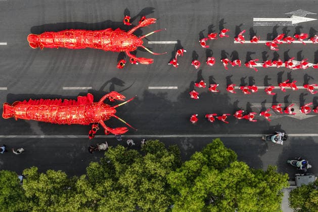 HUAI AN, CHINA - JUNE 12: In an aerial view, people participate in a crayfish-themed parade on June 12, 2026 in Xuyi County, Huai an City, Jiangsu Province of China. A crayfish-themed parade is held on June 12 and June 13 in Xuyi County, a well-known crayfish production hub in China.  Copyright: xChinaxNewsxServicex 111647767463