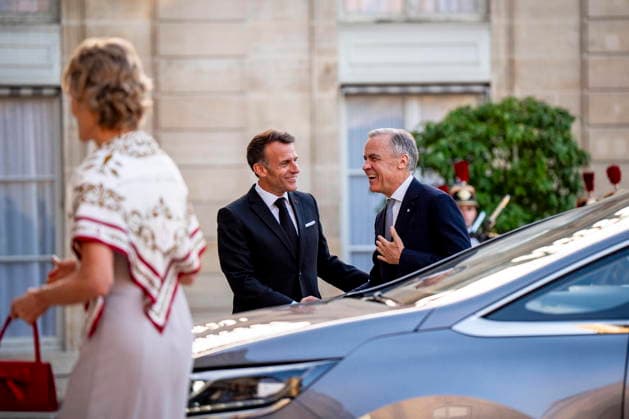 June 12, 2026, Paris, France: French President Emmanuel Macron, left, greets Canadian Prime Minister Mark Carney, while Diana Fox Carney walks in the courtyard of the Palais de löÄÃ Elysee in Paris, on Friday, June 12, 2026. Paris France  - ZUMAc35_ 20260612_zaf_c35_322 Copyright: xChristopherxKatsarovx