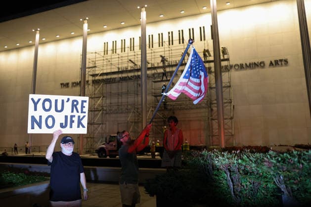 June 13, 2026, Washington, District Of Columbia, USA: Demonstrators gather as a crowd awaits the removal of U.S. President Donald Trump s name fromÃ‚ the facade of the John F. Kennedy Center for the Performing Arts in Washington, D.C. on June 13, 2026. The Trump administration was ordered to remove the Trump name from the building following a court order and failed appeals by the Kennedy Center board. As of midnight, the President s name remained on the building. Washington USA - ZUMAd227 20260613_znp_d227_009 Copyright: xBryanxDozierx
