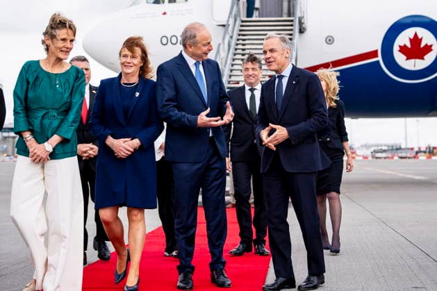 June 13, 2026, Dublin, Ireland: Prime Minister Mark Carney walks alonside the Taoiseach of Ireland Micheal Martin while Diana Fox Carney speaks with spouse of the Taoiseach, Mary Martin, after arriving in Dublin, Ireland, on Saturday, June 13, 2026. Dublin Ireland  - ZUMAc35_ 20260613_zaf_c35_007 Copyright: xChristopherxKatsarovx