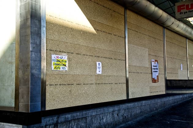 June 13, 2026, Geneva, Canton Of Geneva, Switzerland: GENEVA, SWITZERLAND Ã¢â‚¬ JUNE 13, 2026: An anti-G7 protest flyer reading NO-G7 YES to true democracy is seen taped onto protective wooden panels covering the facade of a large retail store in downtown Geneva. Ahead of the upcoming 52nd G7 Summit in nearby o°vian-les-Bains, France, major commercial businesses in the Swiss city have completely boarded up their windows to prevent potential vandalism, while posting signs to inform customers they remain open during the security operations. Geneva Switzerland  - ZUMAc267 20260613_zip_c267_006 Copyright: xMarcoxCordonex