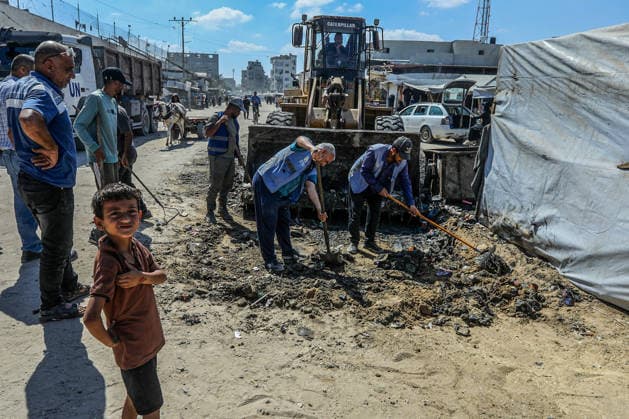 Teams affiliated with UNRWA carry out cleaning operations in Khan Yunis KHAN YUNIS, GAZA, PALESTINE - JUNE 13: Teams from the United Nations Relief and Works Agency for Palestine Refugees in the Near East (UNRWA) use heavy machinery to remove garbage piled up on the streets of Khan Yunis, Gaza, Palestine, on June 13, 2026. Waste has been accumulating on streets and near residential areas due to severe damage to infrastructure caused by attacks, insufficient municipal vehicles. Abed Rahim Khatib Anadolu Khan Yunis Gaza. Editorial use only. Please get in touch for any other usage.  Copyright: x2026xAnadoluxAbedxRahimxKhatibx