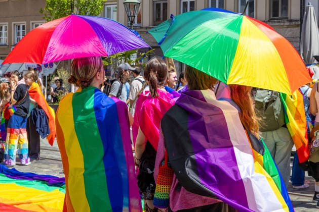 Augsburg, Bavaria, Germany June 13, 2026: Participants carrying rainbow flags and wearing colorful costumes take part in Christopher Street Day (CSD) in Augsburg. The parade through the city center promotes the rights of LGBTQ+ people as well as social diversity and tolerance. Several participants carry various Pride and identity flags *** Teilnehmerinnen und Teilnehmer mit Regenbogenflaggen und bunten Kostümen nehmen am Christopher Street Day (CSD) in Augsburg teil. Der Demonstrationszug durch die Innenstadt wirbt für die Rechte von LGBTQ+-Menschen sowie für gesellschaftliche Vielfalt und Toleranz. Mehrere Teilnehmerinnen und Teilnehmer tragen unterschiedliche Pride- und Identitätsflaggen