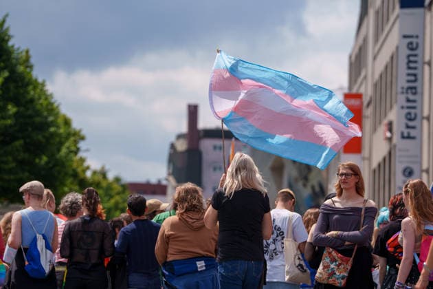 Pride March and Demonstration During CSD in Kassel Germany - Kassel, 13.06.2026 Trans flag as participants take part in the Christopher Street Day (CSD) march in Kassel. Demonstrators marched from Königsplatz through the city centre before returning to Königsplatz, where rallies and speeches were held before and after the procession. Hundreds of people gathered to advocate for LGBTQ+ rights, equality and diversity. Local media reported attendance of around 1,500 participants, though official figures were not immediately available. Hesse