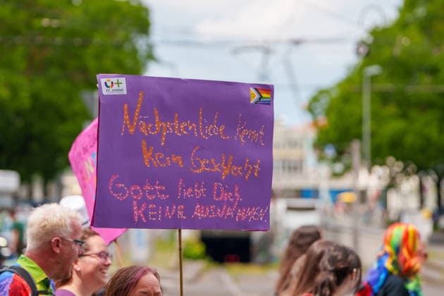 Pride March and Demonstration During CSD in Kassel Germany - Kassel, 13.06.2026 God loves you sign as participants take part in the Christopher Street Day (CSD) march in Kassel. Demonstrators marched from Königsplatz through the city centre before returning to Königsplatz, where rallies and speeches were held before and after the procession. Hundreds of people gathered to advocate for LGBTQ+ rights, equality and diversity. Local media reported attendance of around 1,500 participants, though official figures were not immediately available. Hesse