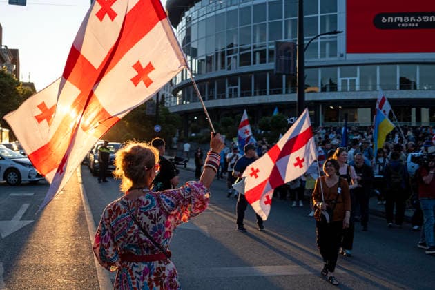 June 13, 2026, Tbilisi, Georgia: Protesters hold Georgian flags as they participate on the 563rd day of anti-government rallies in Tbilisi. Tbilisi Georgia - ZUMAz174 20260613_zip_z174_004 Copyright: xMoexZoyarix