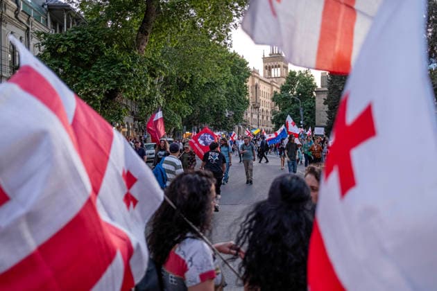 June 13, 2026, Tbilisi, Georgia: Protesters hold Georgian flags as they participate on the 563rd day of anti-government rallies in Tbilisi. Tbilisi Georgia - ZUMAz174 20260613_zip_z174_009 Copyright: xMoexZoyarix