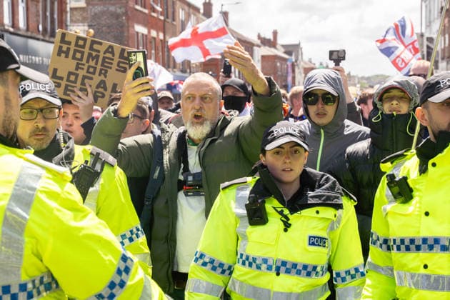 Anti-immigration protest march, Walton, Liverpool, UK, 13 June 2026. A large police presence prevents major disorder at an anti-immigration, pro-deportation protest march in Walton, Liverpool, UK, 13 June 2026., Credit:John Johnson Avalon  Copyright: xJohnxJohnsonx xAvalonx 1109948539