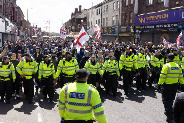 Anti-immigration protest march, Walton, Liverpool, UK, 13 June 2026. A large police presence prevents major disorder at an anti-immigration, pro-deportation protest march in Walton, Liverpool, UK, 13 June 2026., Credit:John Johnson Avalon  Copyright: xJohnxJohnsonx xAvalonx 1109948556
