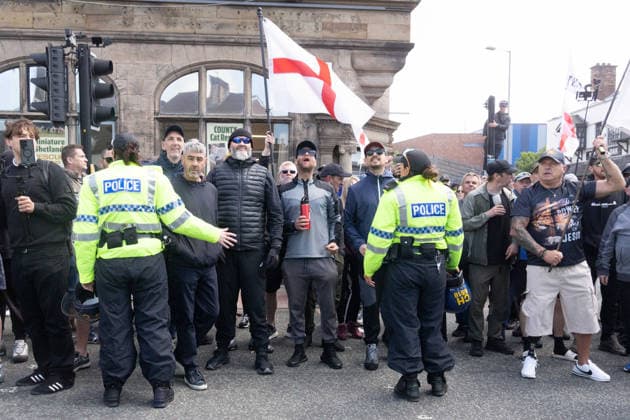 Anti-immigration protest march, Walton, Liverpool, UK, 13 June 2026. A large police presence prevents major disorder at an anti-immigration, pro-deportation protest march in Walton, Liverpool, UK, 13 June 2026., Credit:John Johnson Avalon  Copyright: xJohnxJohnsonx xAvalonx 1109948716