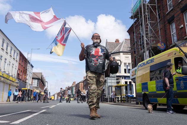 Anti-immigration protest march, Walton, Liverpool, UK, 13 June 2026. A large police presence prevents major disorder at an anti-immigration, pro-deportation protest march in Walton, Liverpool, UK, 13 June 2026., Credit:John Johnson Avalon  Copyright: xJohnxJohnsonx xAvalonx 1109948861