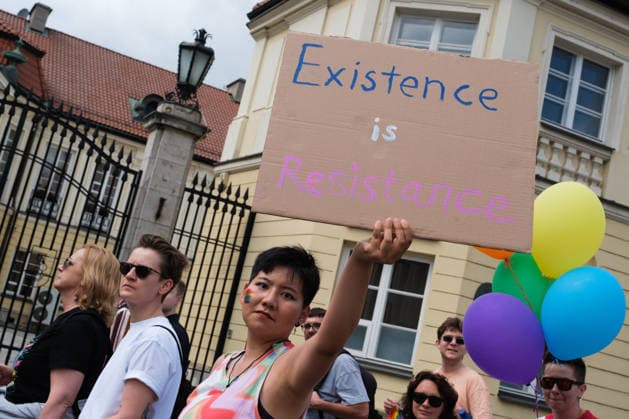 June 13, 2026, Warsaw, Masovian Voivodeship, Poland: A person holds up a sign that reads existence is resistance during the 25th annual Warsaw LGBTQ+ Pride Parade, known in Polish as the Equality Parade. LGBTQ+ people in Poland do not have the right to same-sex civil partnerships, marriage, and child adoption, while also facing homophobia and queerphobia from a largely conservative society. Therefore, the parade is organized primarily as a march for equal rights. Warsaw Poland - ZUMAk204 20260613_zip_k204_021 Copyright: xRomanxKozielx